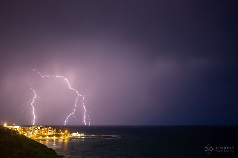 Lightning strike over Ocean Baths, Newcastle, Australia
